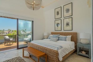 Private King size bedroom with tropical decor and closet space
