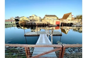 Your own private dock, complete with two kayaks for guest use and a paddle boat.