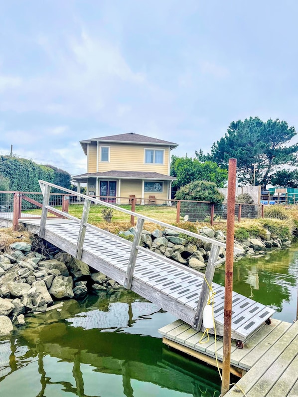 A view of the house from the private dock .
