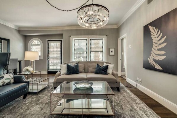 Open Living room with comfy sofa and plenty of seating for your guests.