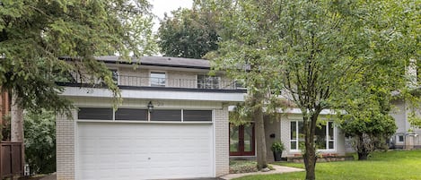 Front of house and entrance to unit left side of the garage. 