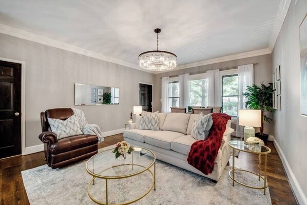 A comfortable living room blending modern elegance,  for the perfect space to relax and unwind.
