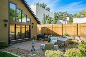 Enjoy this lovely patio area with Traeger Grill and outdoor sound