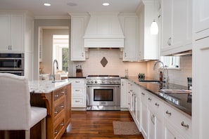 Gourmet kitchen with top of the line stainless steel appliances