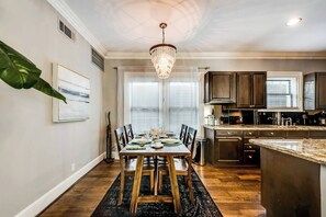 Dining off the kitchen. Elegant and sleek, modern seating, creating the perfect setting for a refined meal.