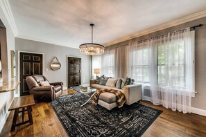 Open living floor plan with an especially comfy sofa to enjoy a movie on the smart TV