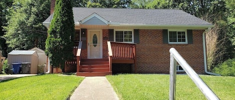 Front entrance of the home. Isn't it the perfect place to enjoy a morning cup of coffee?