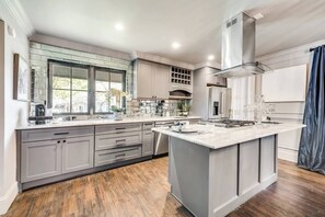 Marble countertops with high-end appliances. 