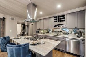 A fully equipped gourmet kitchen with all the essentials, perfect for preparing a delicious meal.