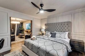 A King-size bed with a smart mattress and luxurious Egyptian cotton linens ensures a restful stay. The bedroom also features a dedicated workspace, ideal for productivity and focus.