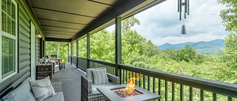 Enjoy the gas fire table on one of several porches with a stunning view. 