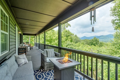 Enjoy the gas fire table on one of several porches with a stunning view.