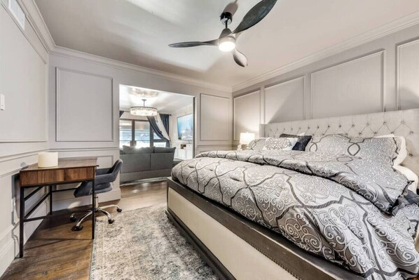 Bedroom with dedicated workspace and king size bed