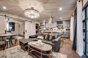 Relax on the comfy leather sectional  both offering great views of the  smart Tv