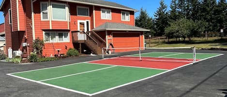 front of home with Pickle Ball Court!
