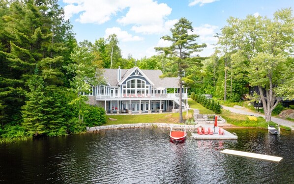 Front of property w/ lake views