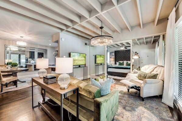 Spacious living room with recliner,  smart TV and Alexa.