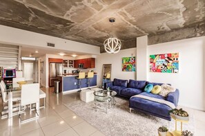 Embrace the mantra of eat, relax, repeat in our inviting kitchen, dining, and living area.