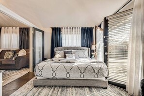 King size bed with luxury linens and hotel quality mattress. Enjoy your morning coffee on the private patio off the bedroom.