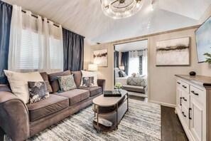 Enjoy a book or your favorite show in our spacious living room with comfy sofa and Smart TV.
