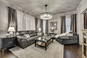 The large living room is spacious and inviting, offering plenty of room to relax and unwind.