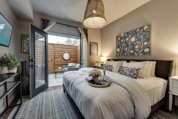 Restful bedroom with private patio. King size bed. 43" smart television.