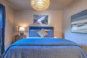 Relax in your queen bed and unwind in the spacious, open area, designed for comfort and tranquility.