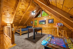 Loft bedroom with several entertainment options