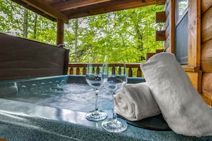 Relax in the cozy hot tub on our private deck