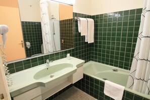 Get ready for the day ahead in our spacious bathroom!