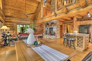 Open concept main floor plan with wood burning fireplace