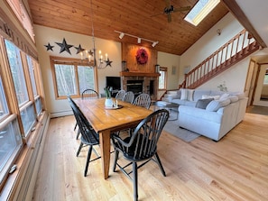 Dining and kitchen areas with access to rear deck