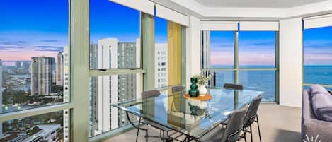 Dining area is right next to the balcony overlooking the ocean and the city