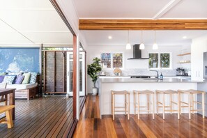 The kitchen opens out onto the deck.