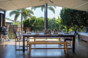 Ample seating around the alfresco dining table on the deck.