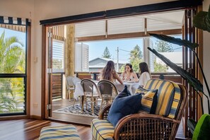 Separate dining room with open air windows.