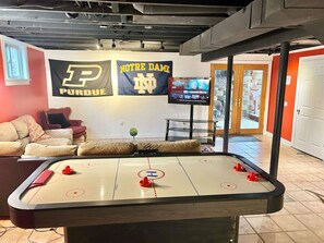 Basement Hangout Room- Tv- Air hockey table- Bar top card table- Half bathroom