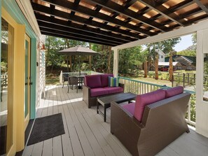 The spacious front porch is great for relaxing and enjoying the yard.