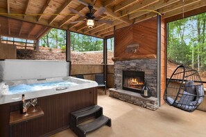 Hot tub for 6 on screened in porch by fireside. Private reading spot egg chair