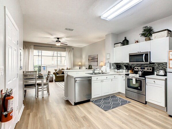 Bright open kitchen and dining area, perfect for family meals and gatherings.