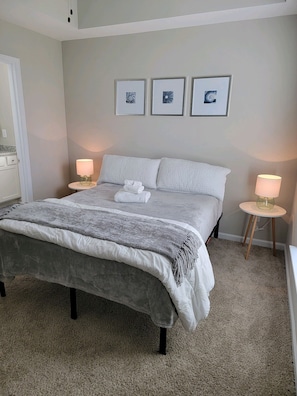 Comfortable and relaxing QUEEN primary bedroom with ensuite bathroom. 