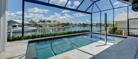 Luxurious heated salt water pool with swim shelf and spa with Spectacular basin view... with an outdoor shower!