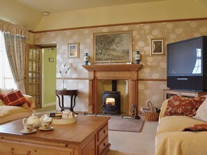 Tastefully furnished living room with wood-burning stove | Gordons Hall Cottage, Carnbee, near Anstruther