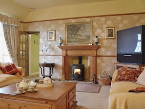 Tastefully furnished living room with wood-burning stove | Gordons Hall Cottage, Carnbee, near Anstruther