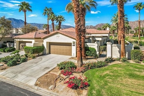 Front of Casa Lily including driveway and front entry to large courtyard