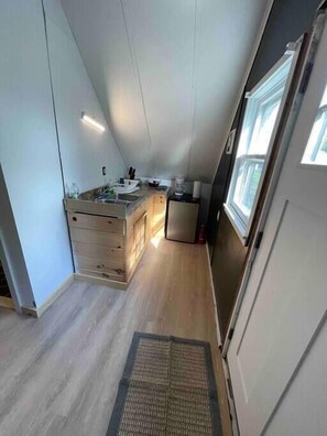 Kitchenette with small fridge/freezer microwave and kurig
