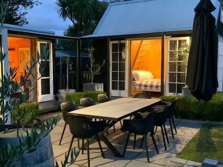 Two cabins and outdoor area taken from separate living area