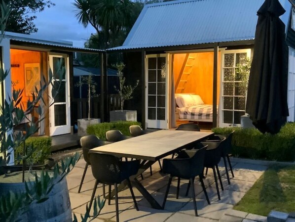 Two cabins and outdoor area taken from separate living area
