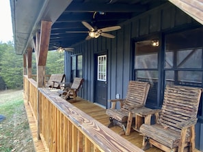 Porch swing and 3 rockers on the front porch