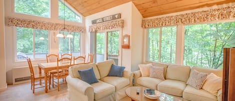 Lots of natural light surrounded by trees with views of Loon Mountain.